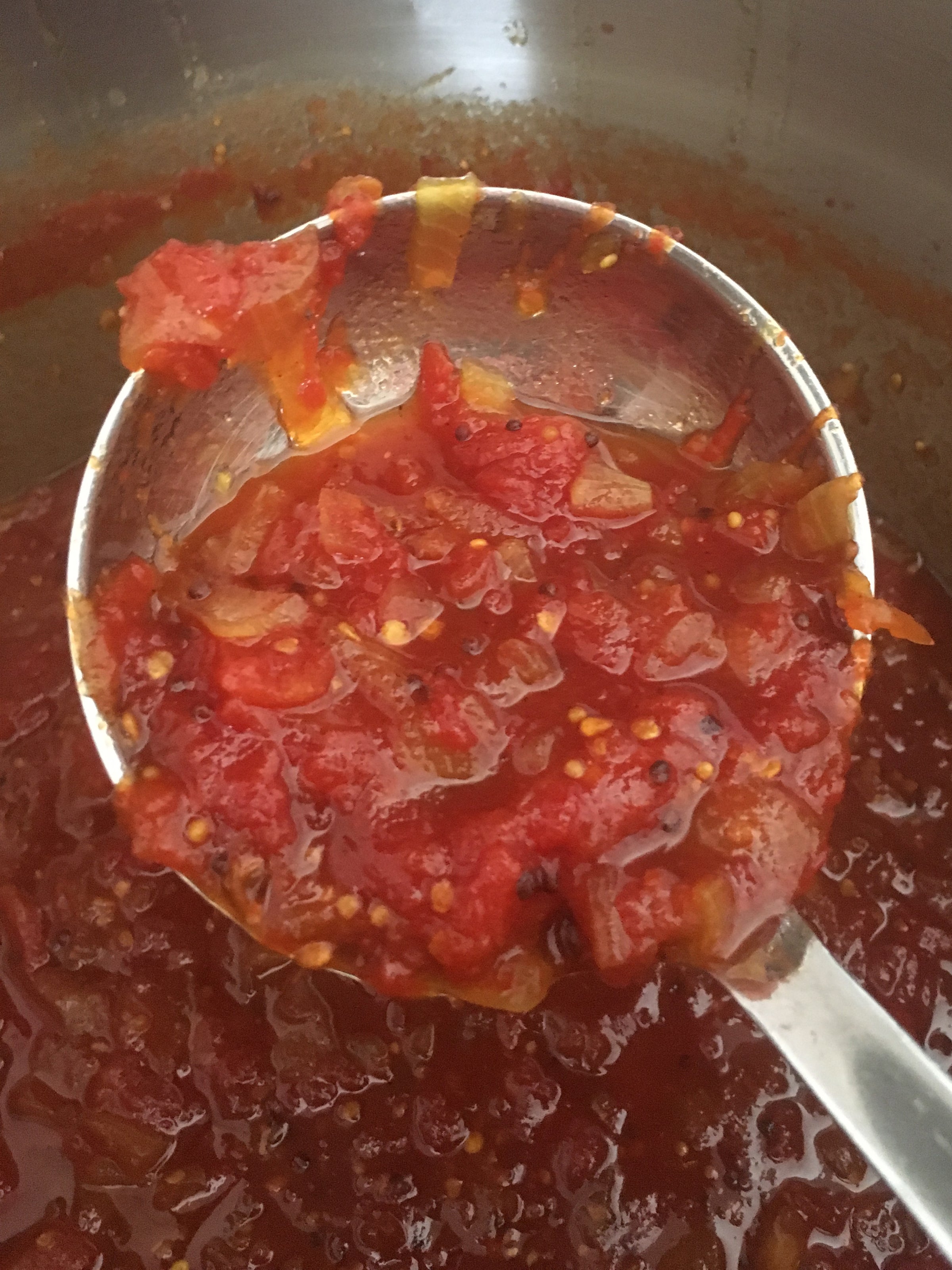 Ladle spoon full of BatchMade tomato relish