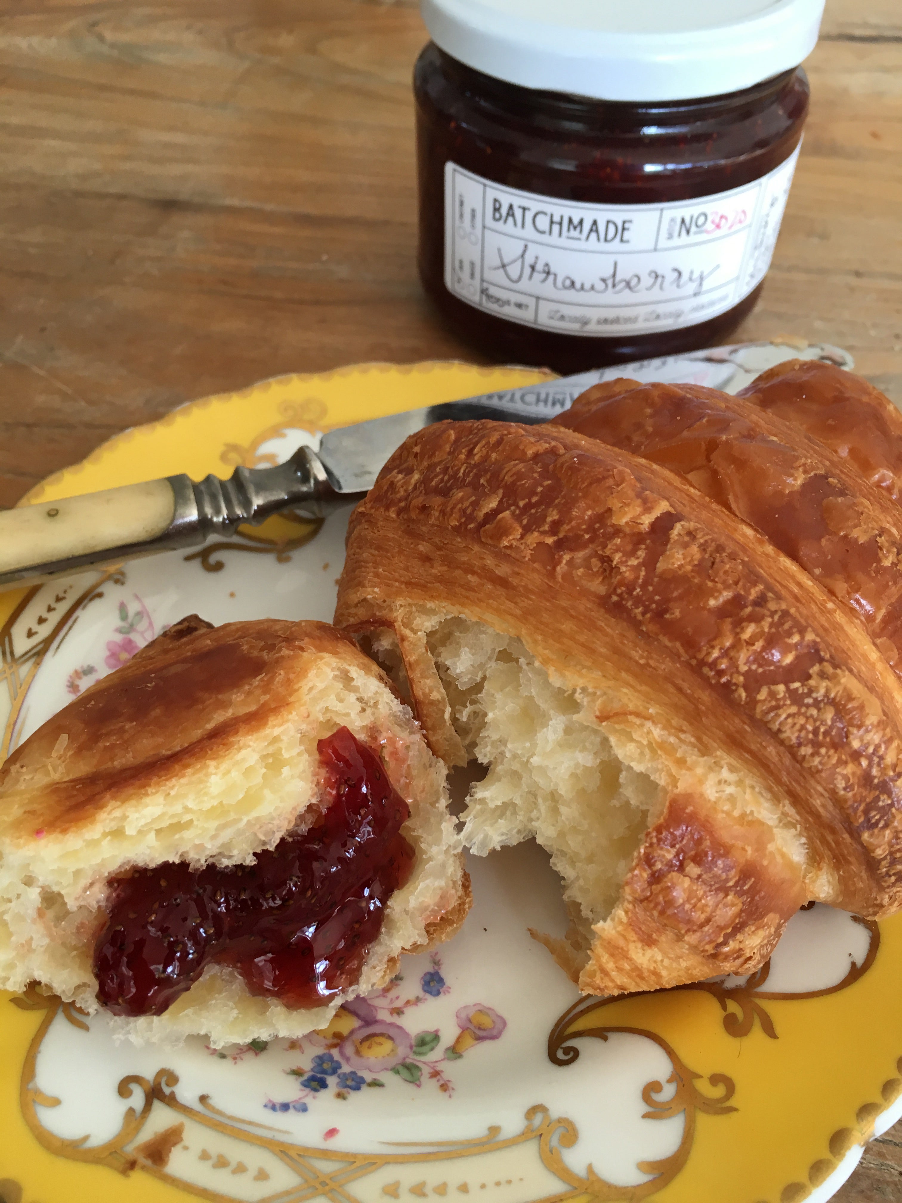 Strawberry jam with croissant
